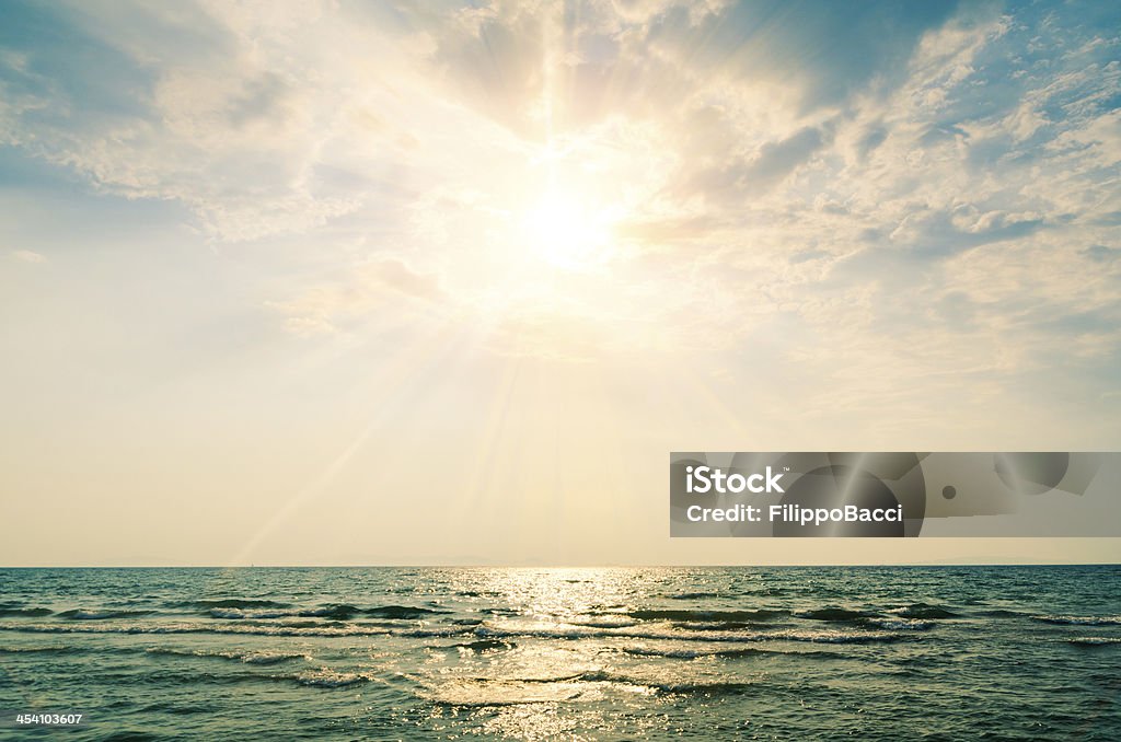 Horizon over sea at sunset Backgrounds Stock Photo