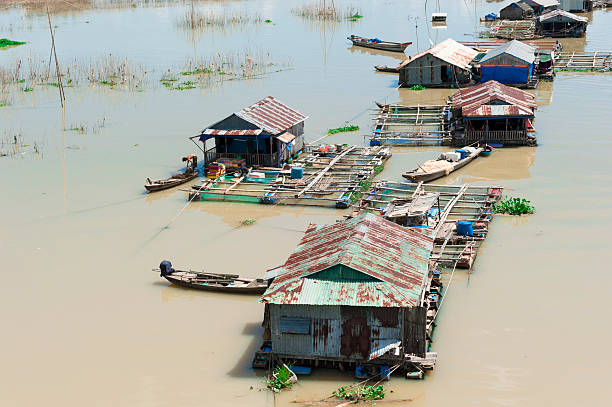 istock Floating houses, community on fresh water for cultivating fish 454103783