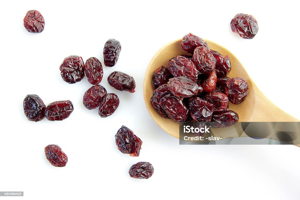 dried cranberry dried cranberry in a wooden spoon Cranberry Stock Photo