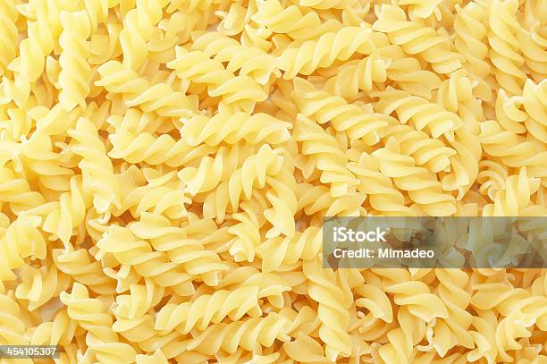 Background With Close Up Of Spiral Fusilli Pasta Stock Photo - Download Image Now - Backgrounds, Carbohydrate - Food Type, Close-up