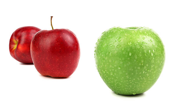 istock green apple with water drops and two red 454105395