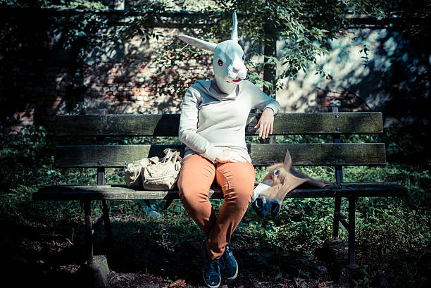young hipster rabbit mask woman in autumn stock photo