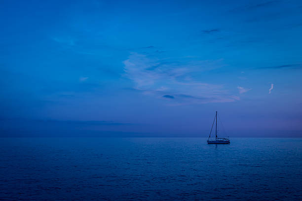 istock Sailing boat in the evening sea. 454107029