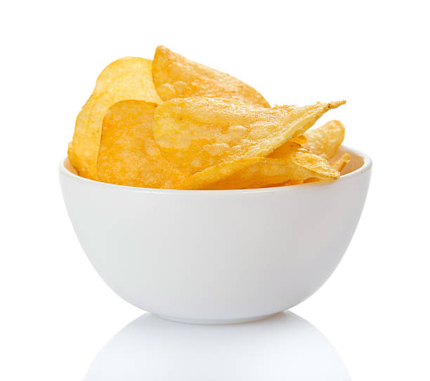 istock Appetizing golden chips in faience bowl 454118881