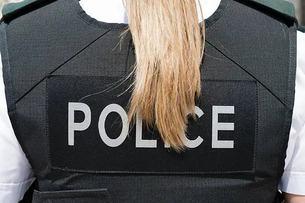Policewoman wearing bulletproof vest