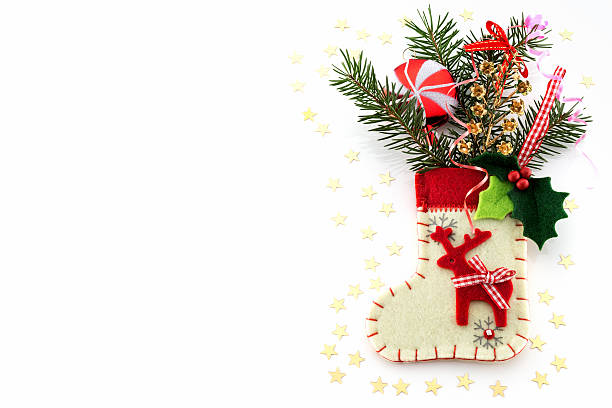 istock Christmas decorations and sock on white background 454124171