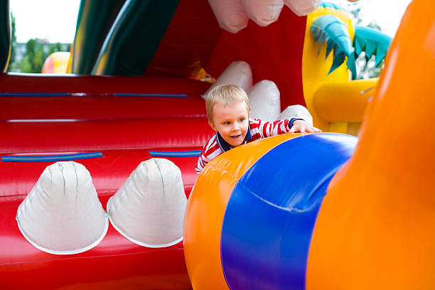 istock Four-year-old kid playing on a trampoline 454124797