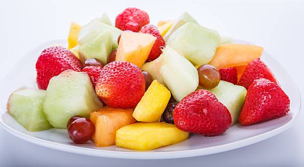 istock White Plate of Cut Fruit 454125077
