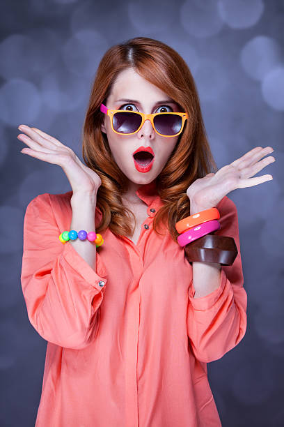istock Surprised redhead girl in sunglasses 454125097
