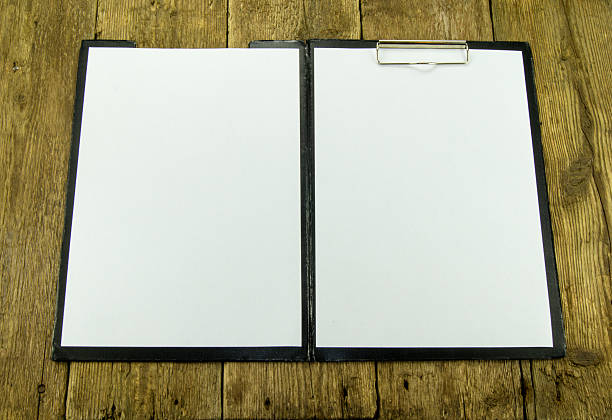 istock White paper on wood background 454126639