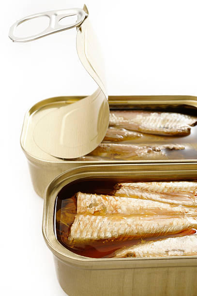 istock sardines in extra virgin olive oil on white background 454126669
