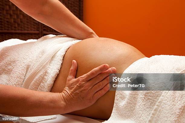 Young Pregnant Woman Receiving Relaxing Massage Stock Photo - Download Image Now - Massaging, Pregnant, Abdomen