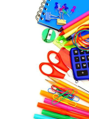 Colorful border of school supplies over a white background