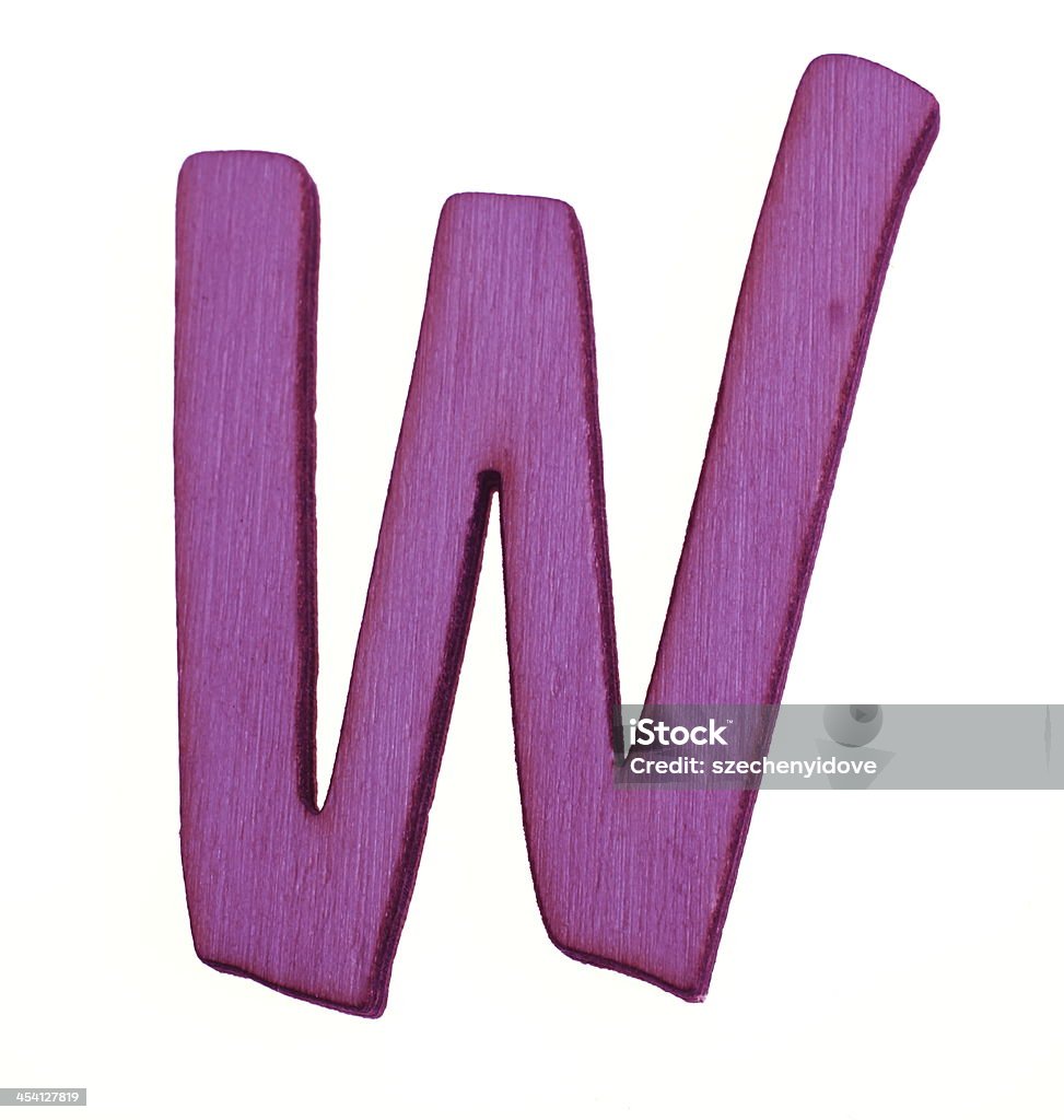 Wooden Letter W A wooden purple color Latin capital letter W on white. Alphabet Stock Photo