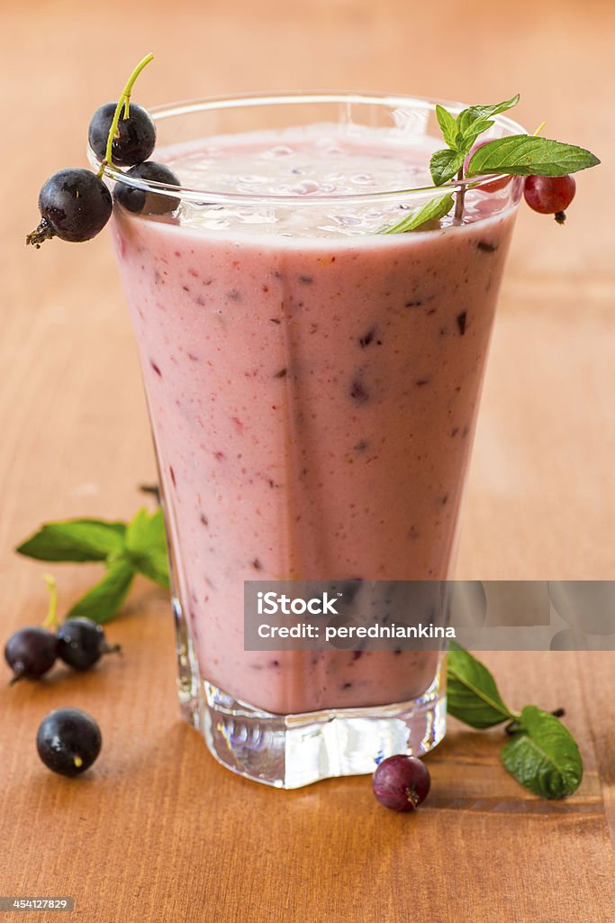 summer smoothies black currant in the cup summer smoothies black currant in the cup on the wooden table Berry Fruit Stock Photo