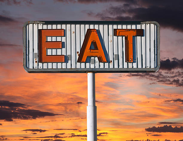 istock Old Eat Sign with Sunset Sky 454132951