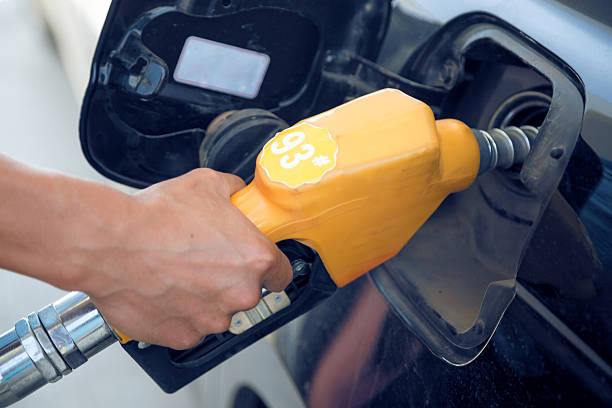 istock gas nozzle adding 93 number oil 454135833