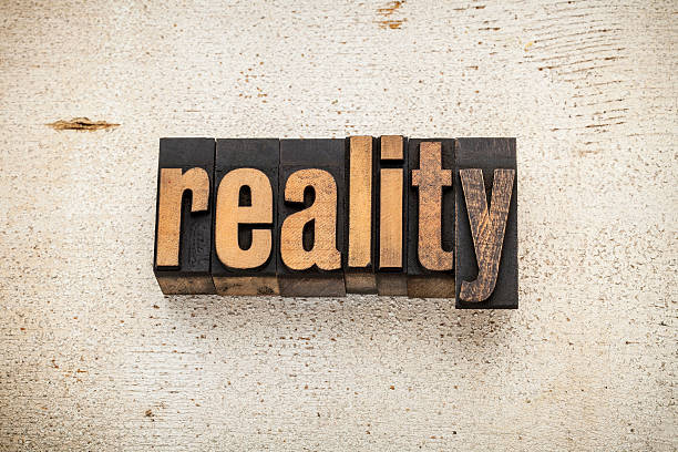 istock reality word in wood type 454136243