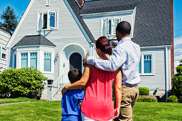 istock Happy Young Family Admiring Home 454136751