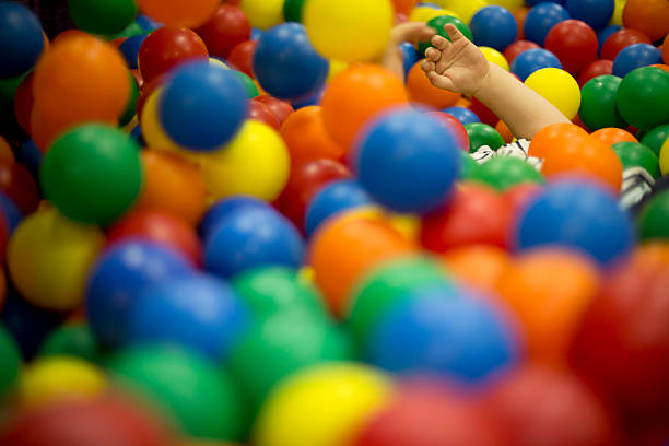 istock Smiling baby on colorful slide 454141779