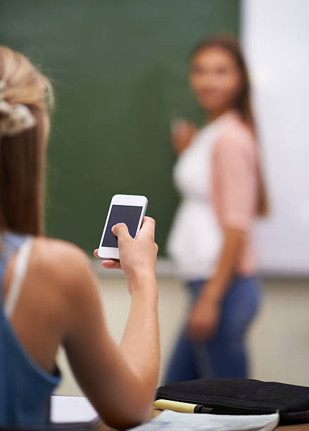 istock Looking for the answer on her cellphone 454141989