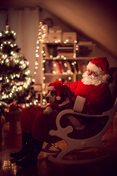 istock Santa Claus and his little helper 454142027
