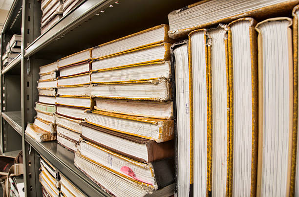 istock Well Used School Textbooks Sitting on Metal Shelf 454142221