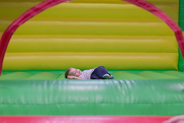 istock Smiling baby on colorful slide 454142233