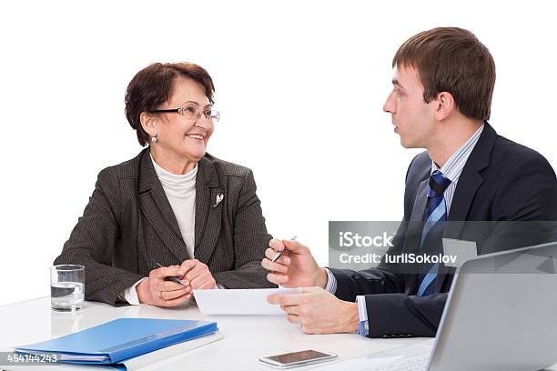 Elderly Woman With A Financial Advisor Stock Photo - Download Image Now - Active Seniors, Adult, Adults Only
