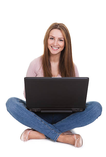 istock Young Woman Working On Laptop Over White Background 454148317