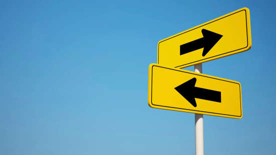 Two way Sign isolated on clean blue sky