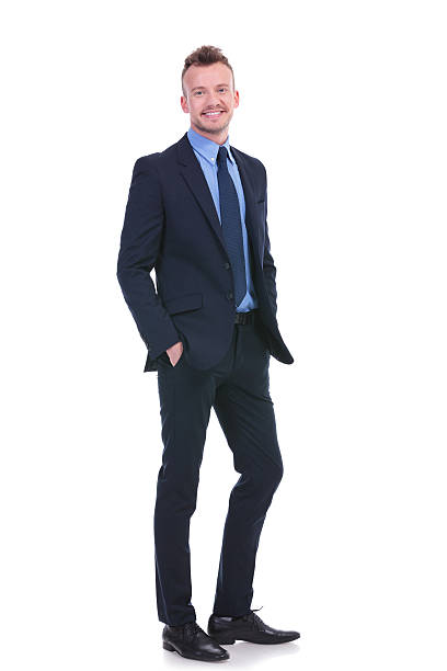 istock business man stands with both hands in his pockets 454153869