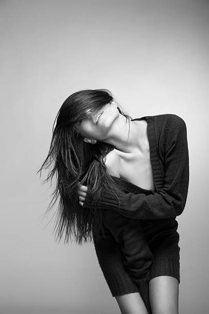istock Attractive smiling woman with long hair on grey 454164643