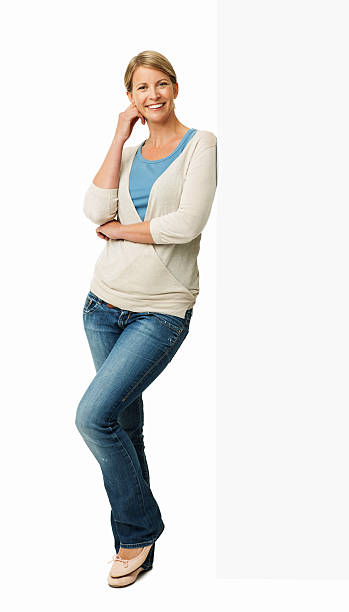 istock Woman In Casuals Leaning On Empty Billboard 454165091