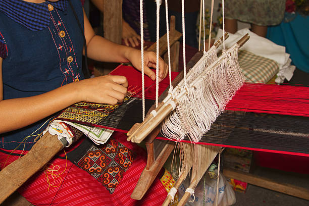 istock Women weaving a cloth  in Chiang Mai 454166187