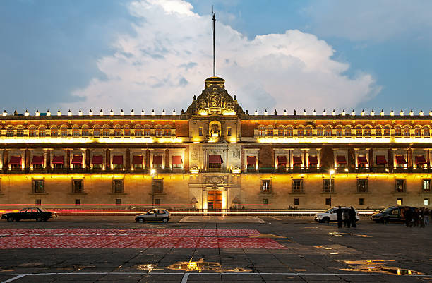 Illuminated National Palace in Zocalo of Mexico City stock photo