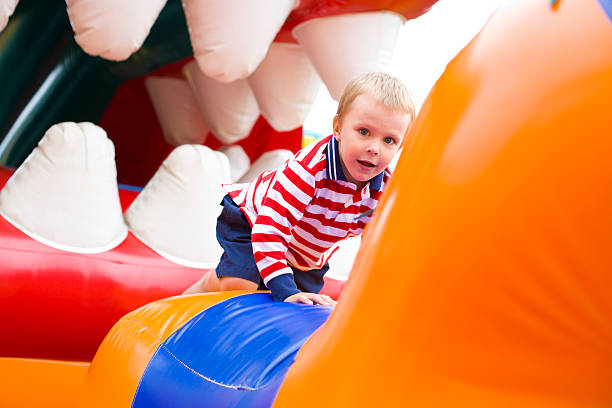 istock Four-year-old kid playing on a trampoline 454166799