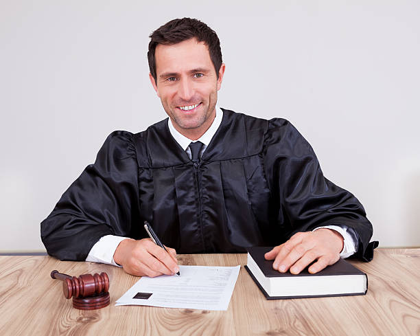 istock Male Judge In Courtroom 454171749