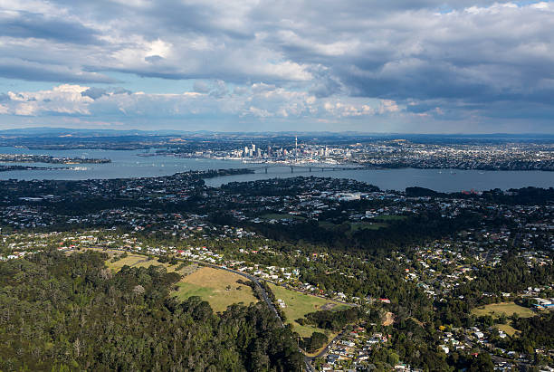 Auckland City and it's northern suburbs from the air with the iconic harbour bridge and sky tower in the mid ground