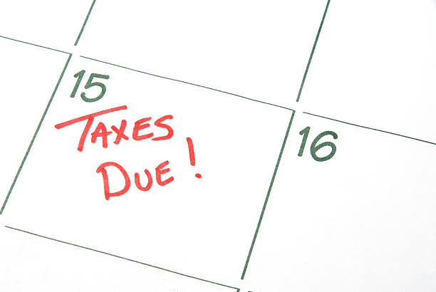 Calendar with taxes due written in red stock photo