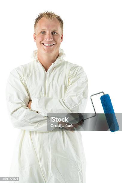 Smiling Young Painter With Paint Roller Stock Photo - Download Image Now - House Painter, Painter - Artist, Arms Crossed