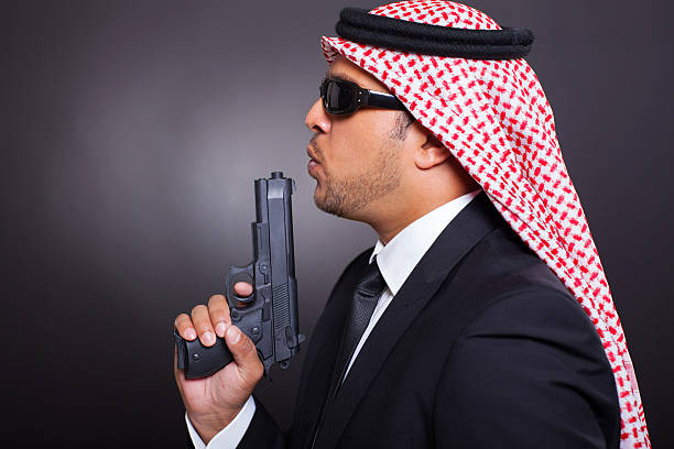 istock arabian bodyguard with pistol 454182343