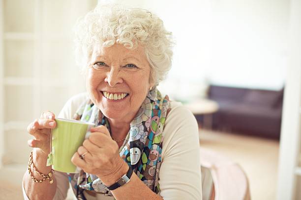 istock Charming Old Lady with a Cup of Tea 454186397