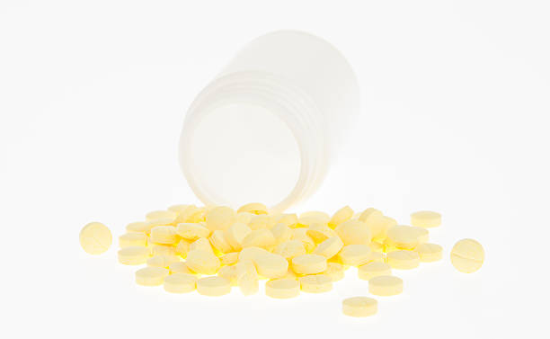 píldoras médicas y los comprimidos - capsule vitamin pill red lecithin fotografías e imágenes de stock
