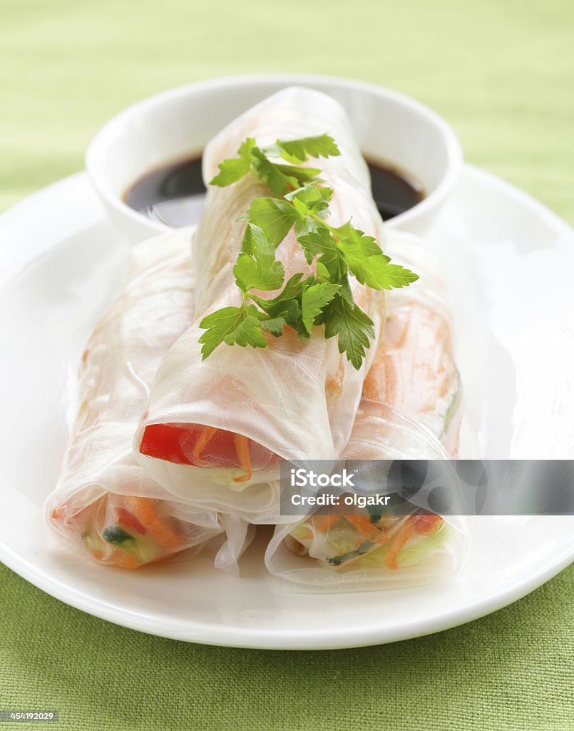 Up close vegetable spring rolls spring rolls with vegetables and chicken on a plate Rice Paper - Food Stock Photo