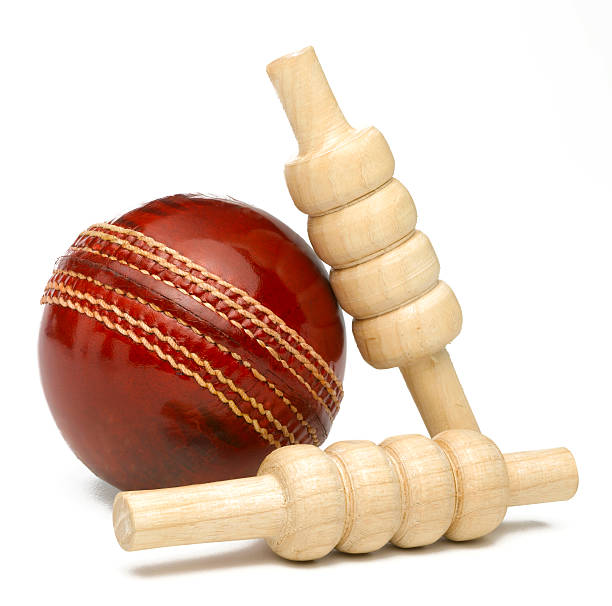 Cricket ball and bales Isolated red leather cricket ball with a pair of bales cricket stump photos stock pictures, royalty-free photos & images
