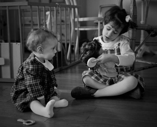 istock Two playing with dolls girls 454197575