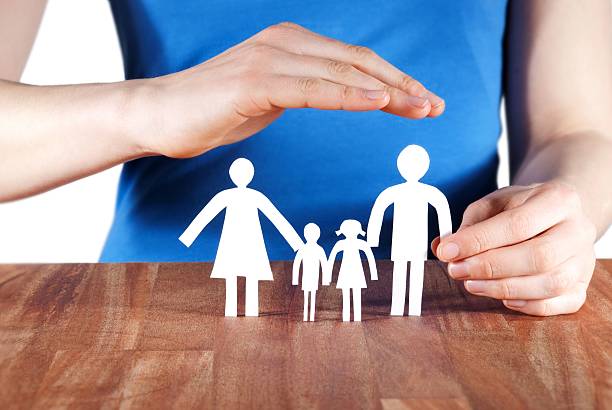 istock hand protecting a family 454205353