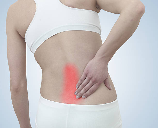 急性痛の女性のバック。 - backache human spine lumbosacral region blue ストックフォトと画像