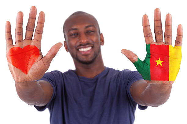 African  man hands with a painted heart and cameroon flag, i love cameroon concept, isolated on white background